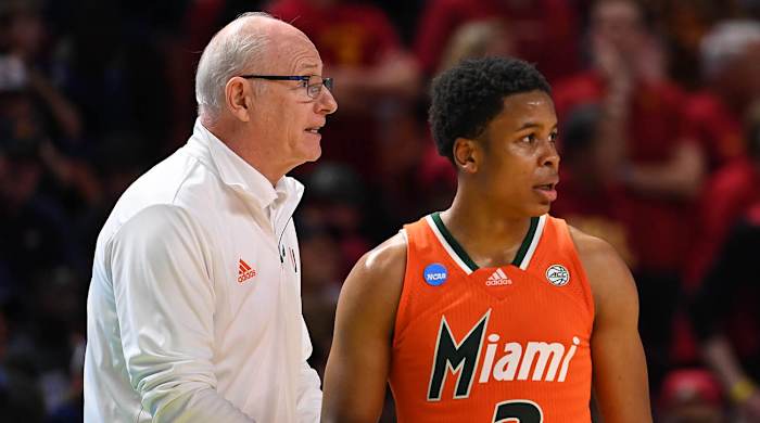 Miami Hurricanes head coach Jim Larranaga talks with Miami Hurricanes guard Charlie Moore (3) against the Southern California Trojans during the first round of the 2022 NCAA tournament at Bon Secours Wellness Arena.